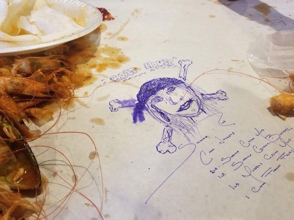 Printed seafood menu with fried and boiled dishes.