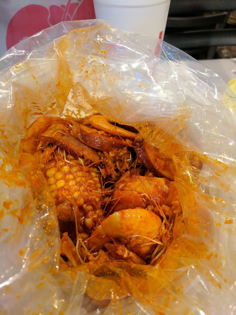 Printed seafood menu with fried and boiled dishes.